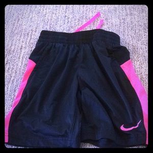 Pink and black Nike shorts
